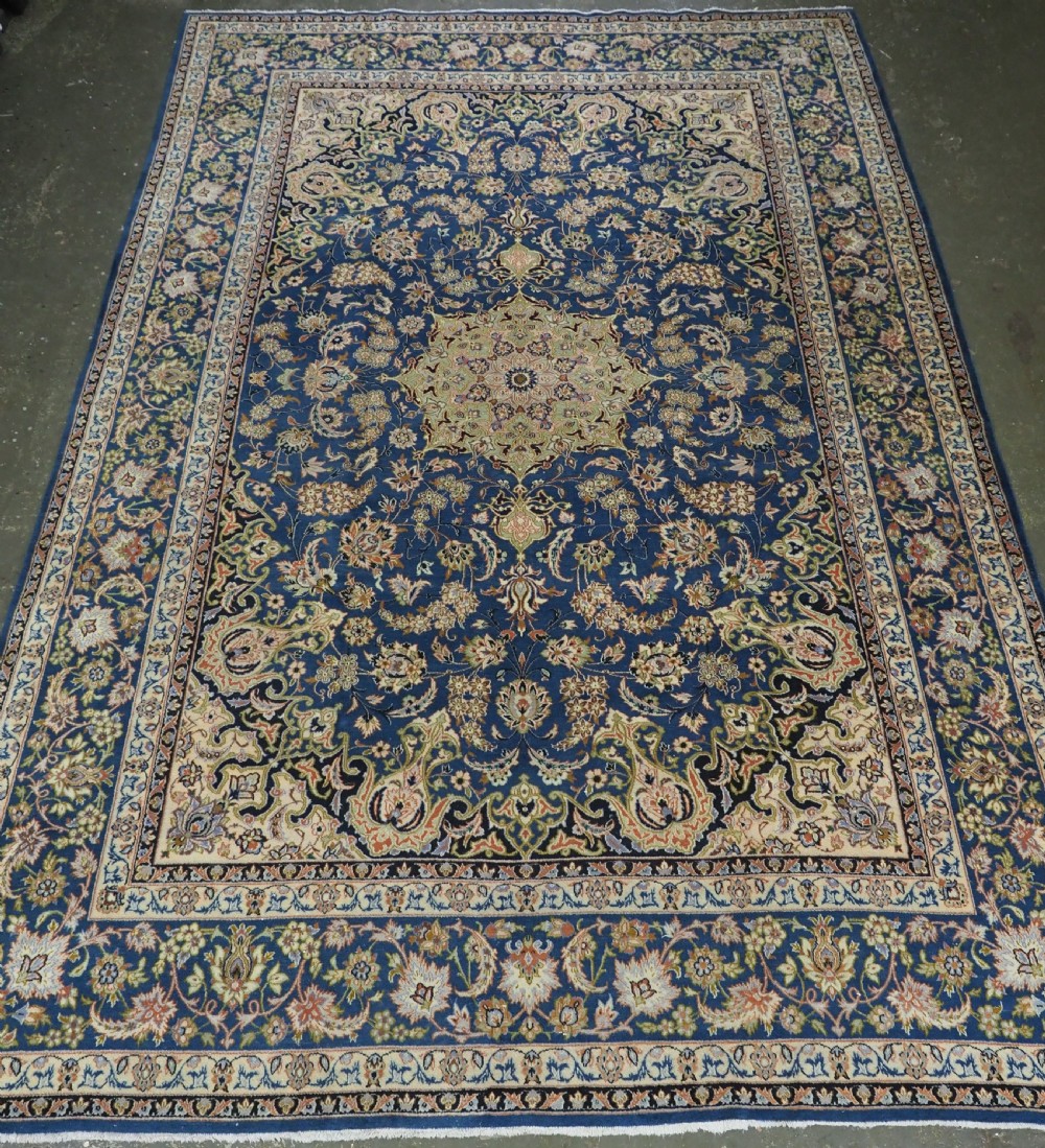 vintage kashan carpet of large size with small medallion design soft greens throughout circa 1930