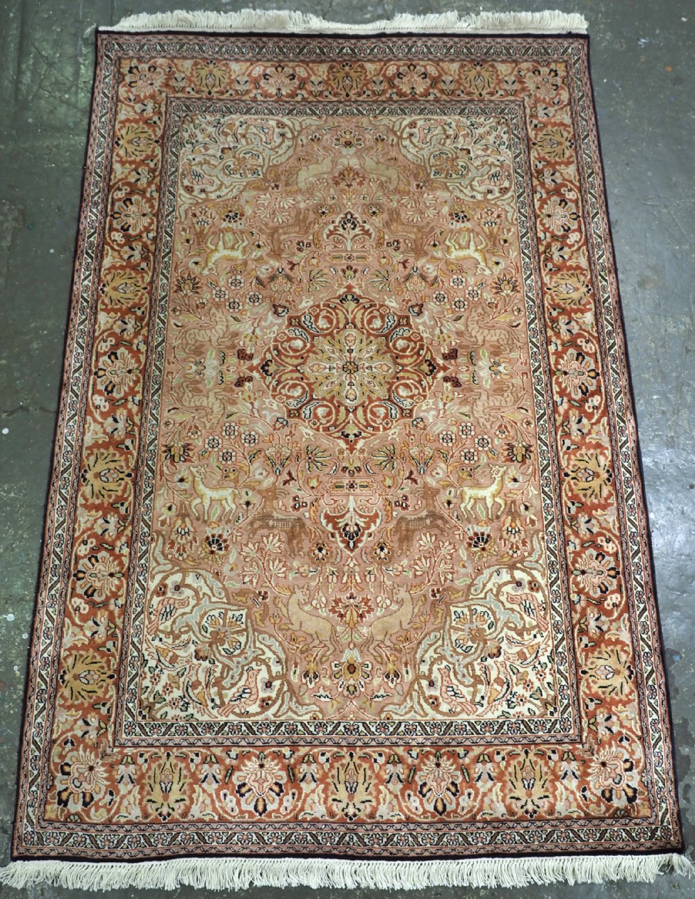 kashmir silk rug with soft colours and traditional garden design about 30 years old