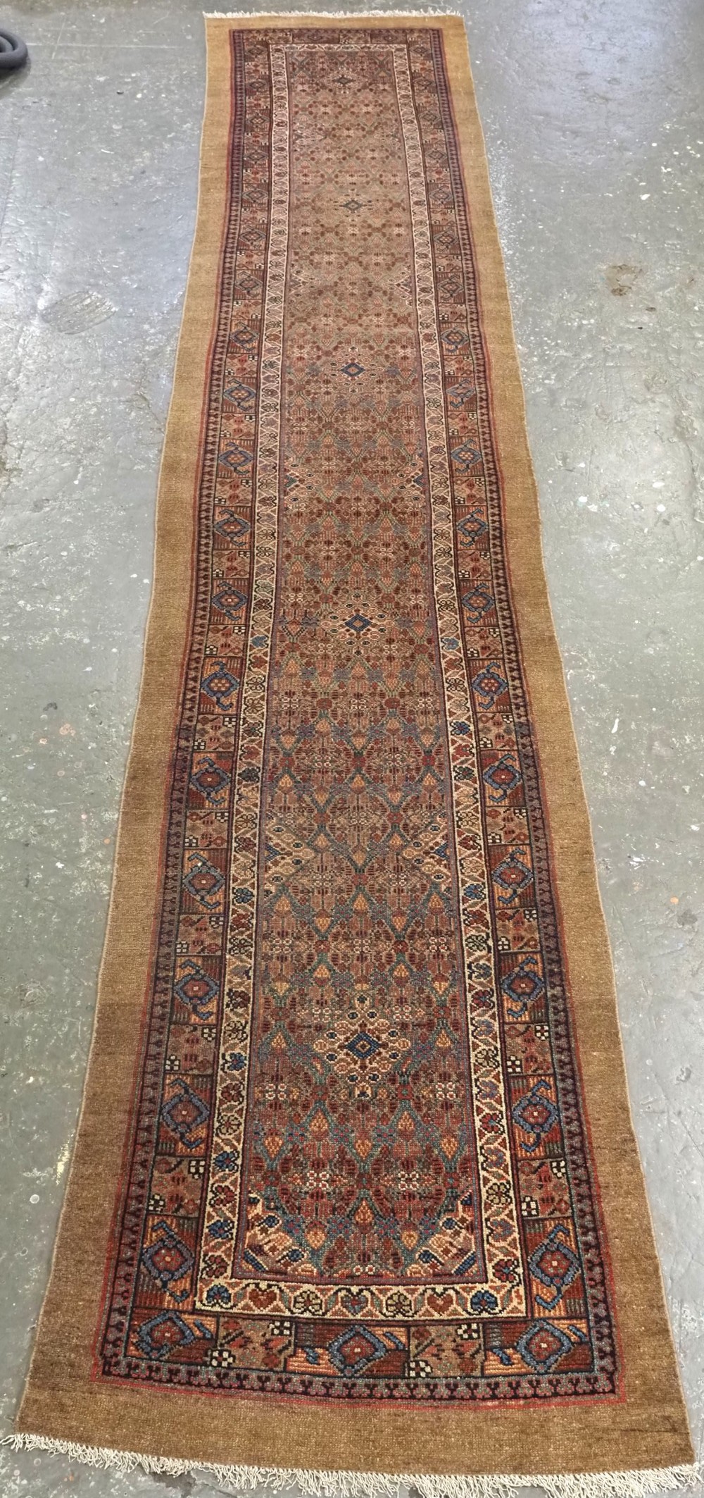 antique sarab narrow runner with camel ground soft colours circa 1880