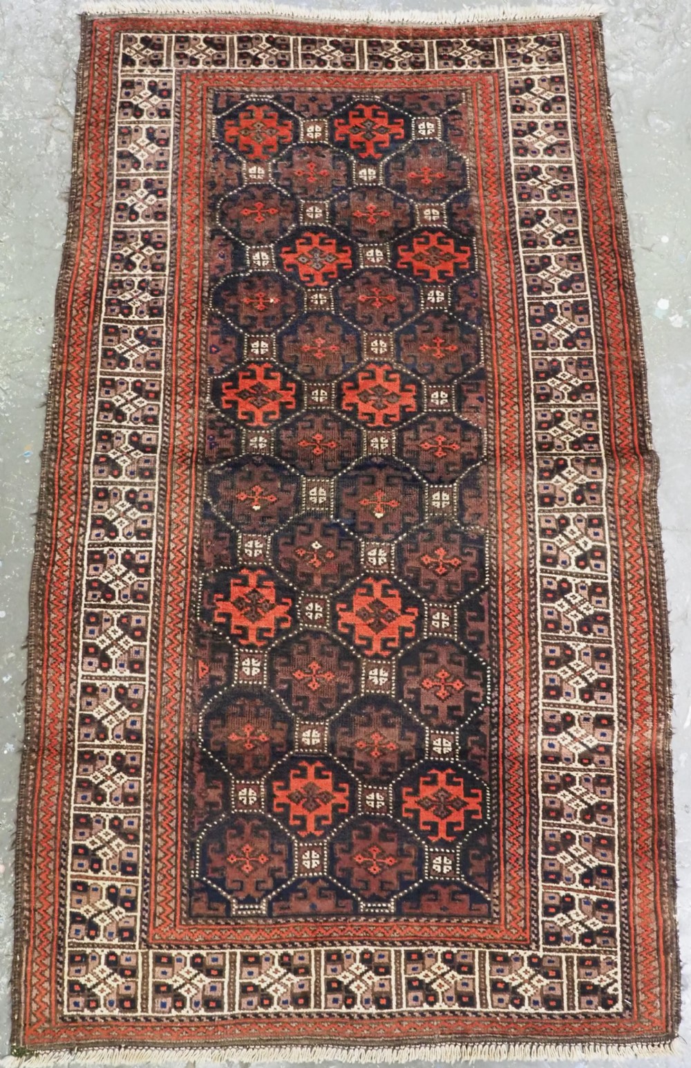 antique bahluli baluch rug lattice design with ivory border circa 1890