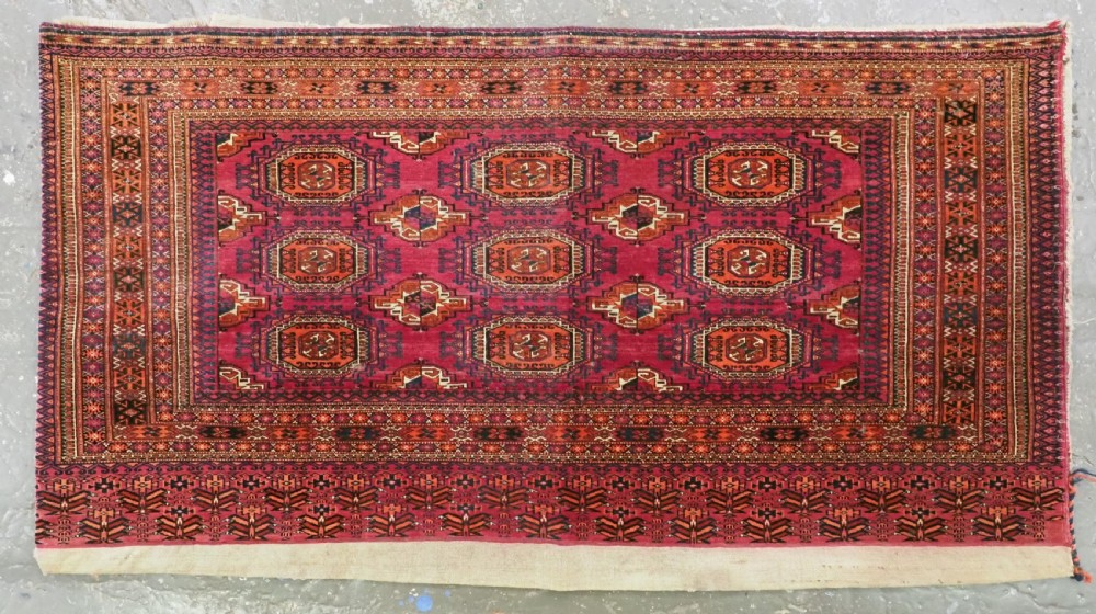 antique tekke turkmen chuval with 'salor' guls complete with back circa 1880