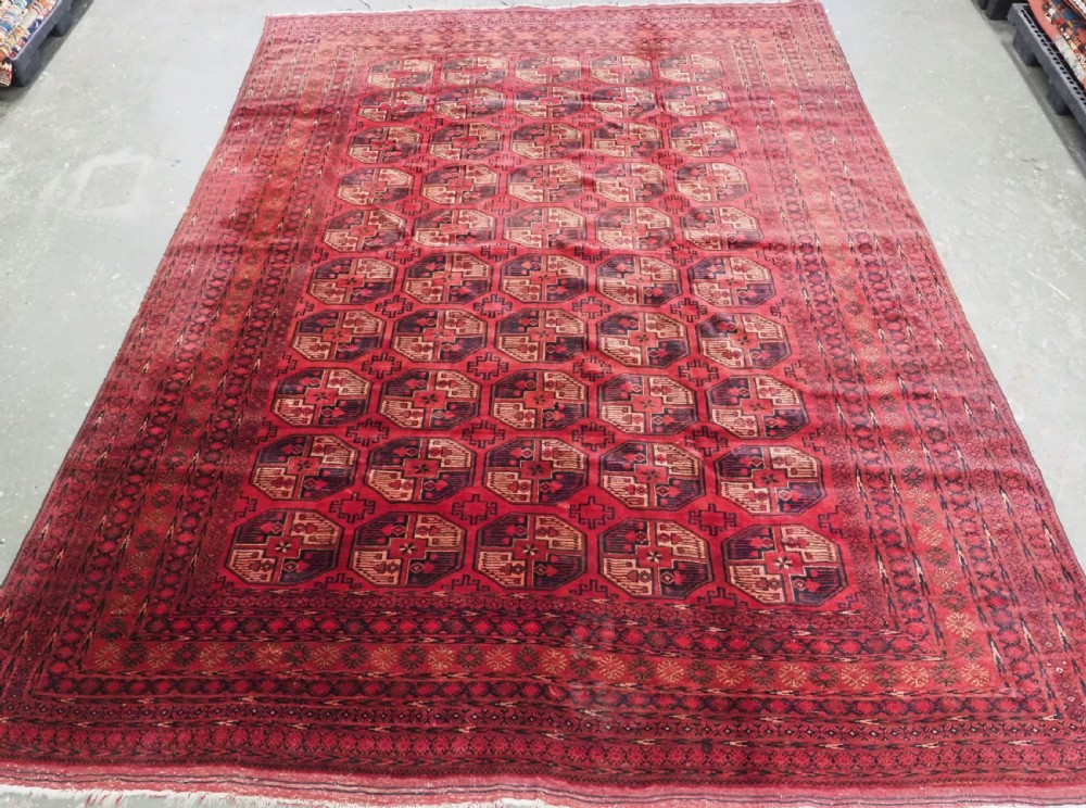 antique afghan turkmen carpet with traditional gul design circa 1920