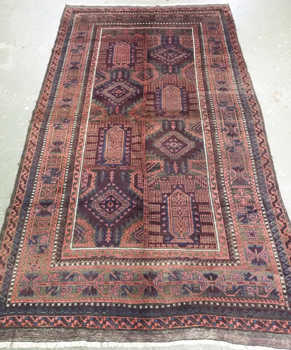 antique afghan baluch or timuri main carpet of traditional design circa 1900