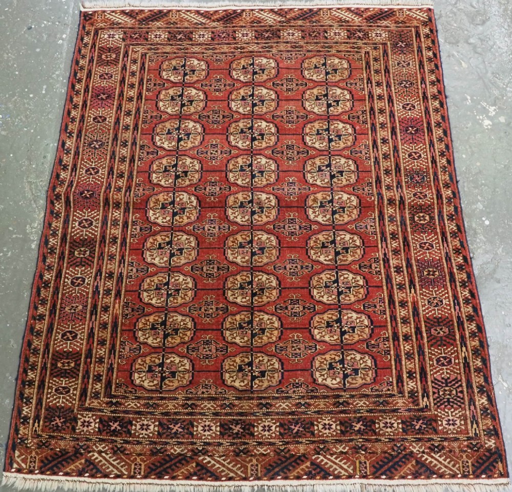 antique tekke turkmen rug with soft madder red ground circa 1900