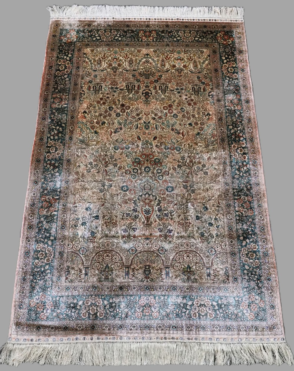 chinese silk rug with traditional floral vase design about 20 years old