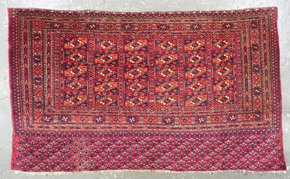 antique tekke turkmen chuval face aina gul design with flower elem late 19th cent