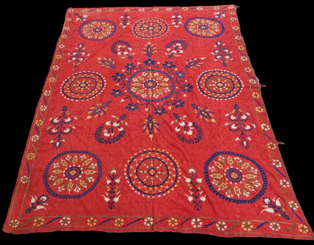 antique uzbek suzani floral design on a red ground circa 1900