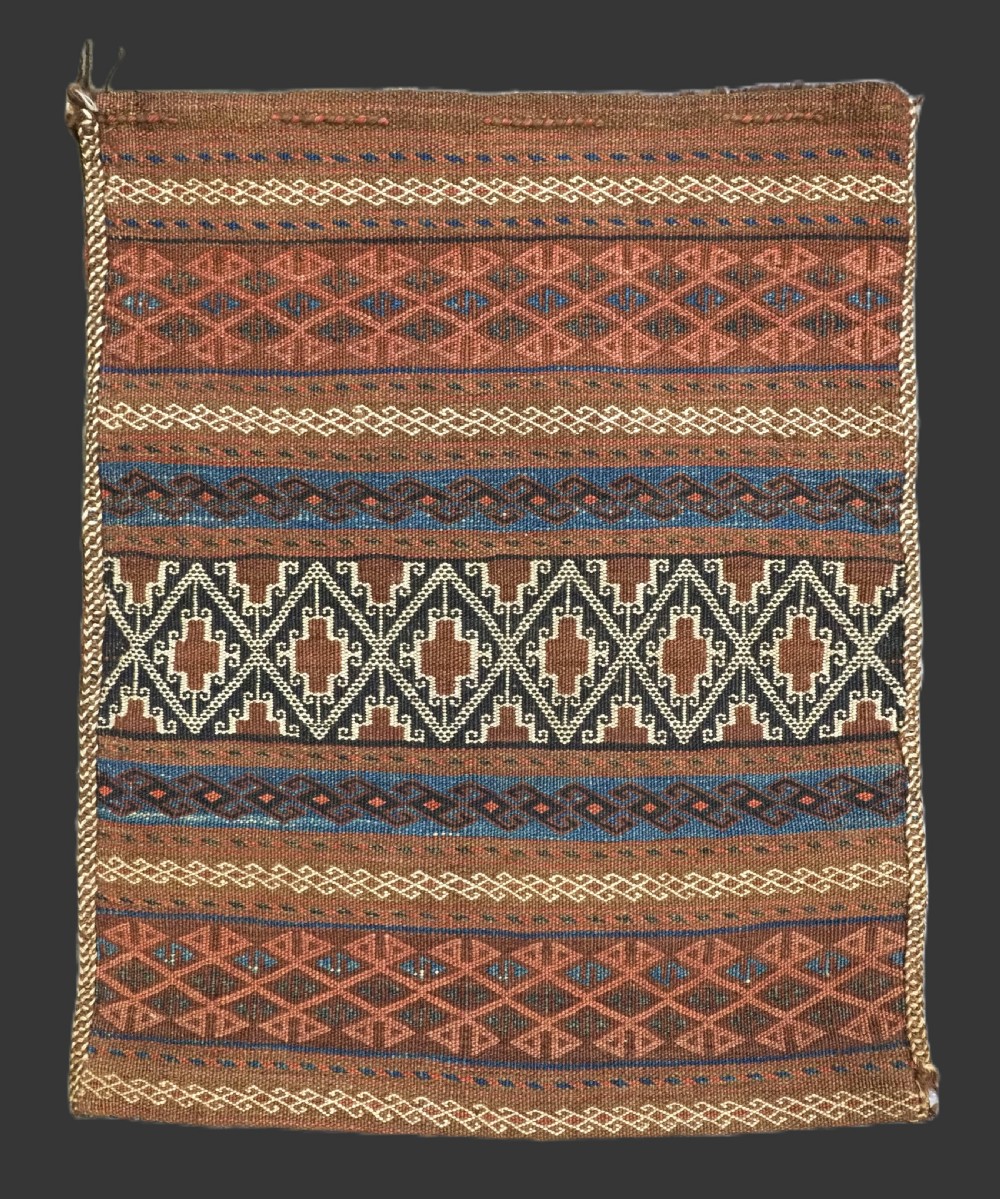 antique baluch storage bag with original back banded weft work design circa 1900