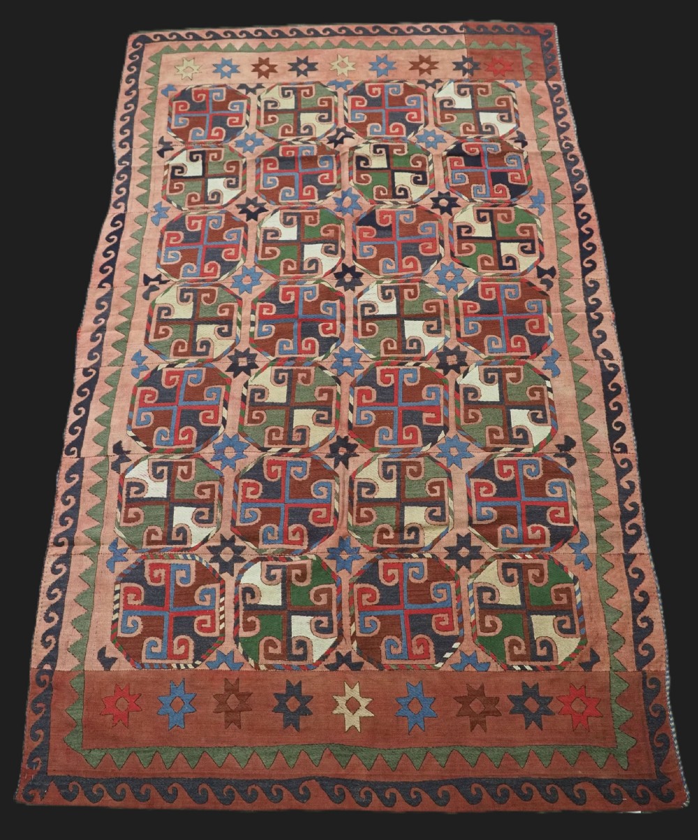 antique uzbek suzani kilim woven in nine strips soft faded red circa 1900