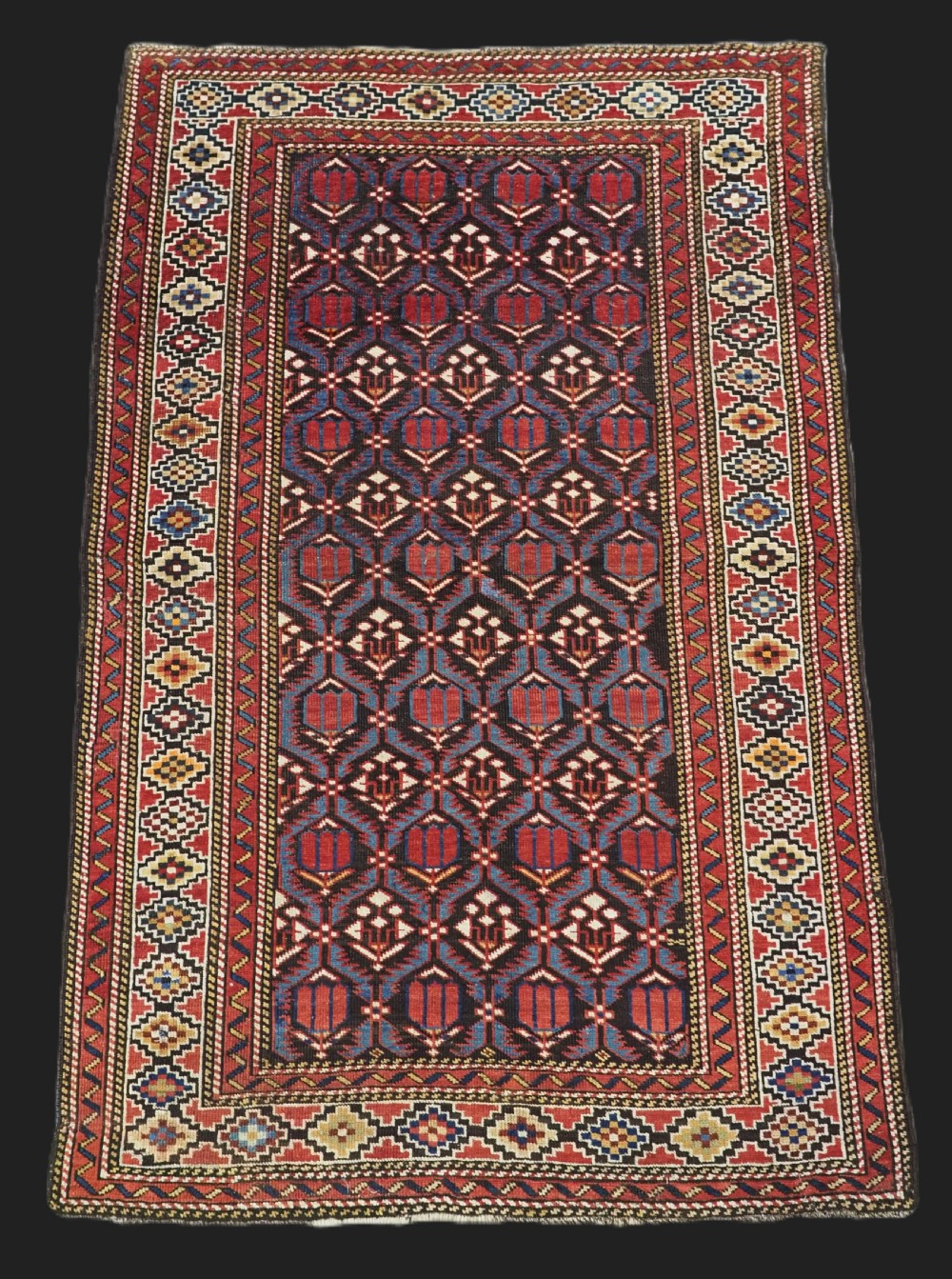 antique caucasian shirvan baku region rug with 'tulips in lattice' design circa 1890