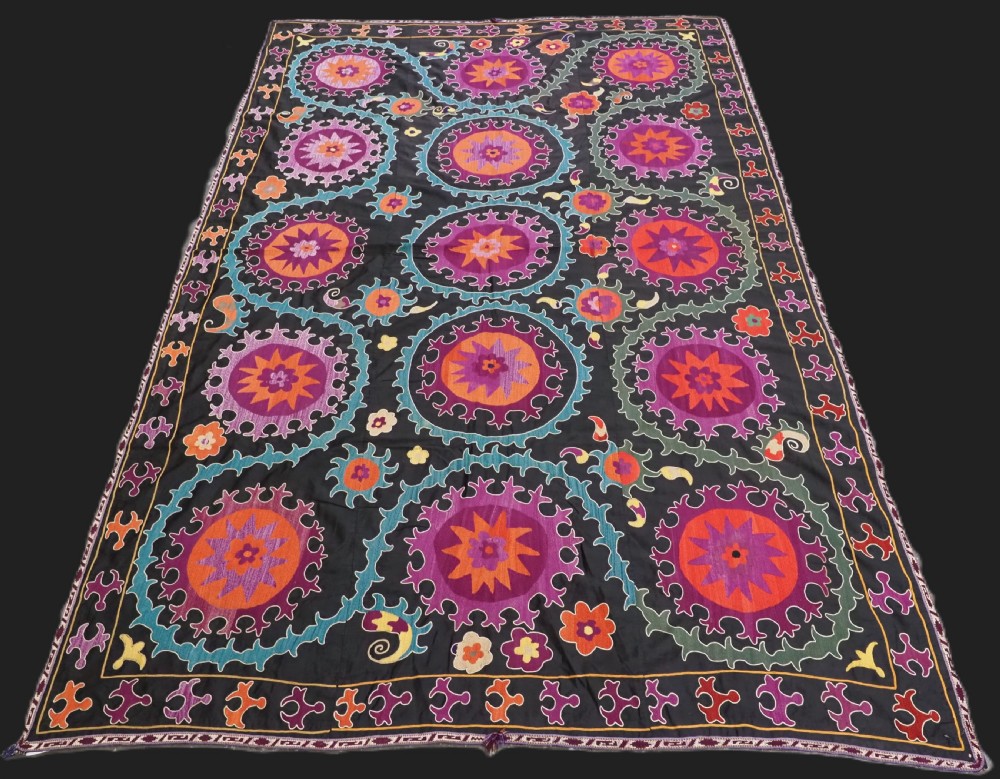 antique uzbek suzani silk on a black cotton ground circa 1900