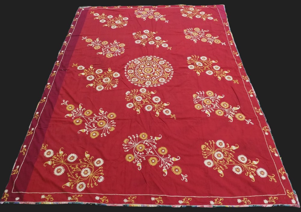 antique uzbek suzani silk embroidery on a red adras silk cotton ground circa 190020