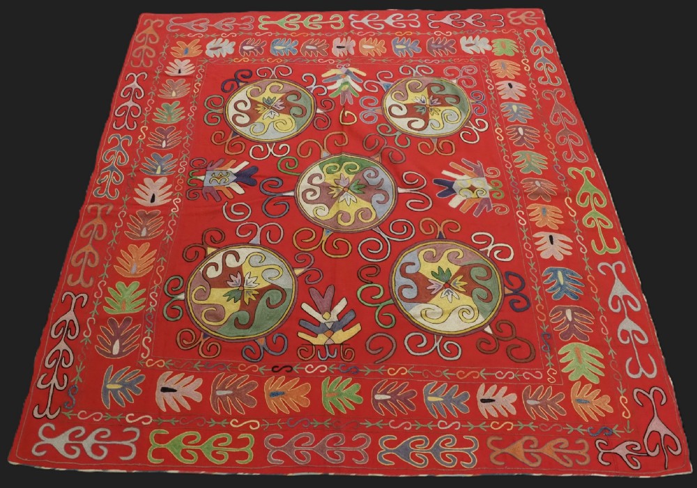 antique uzbek lakai suzani silk on a red wool ground circa 1920