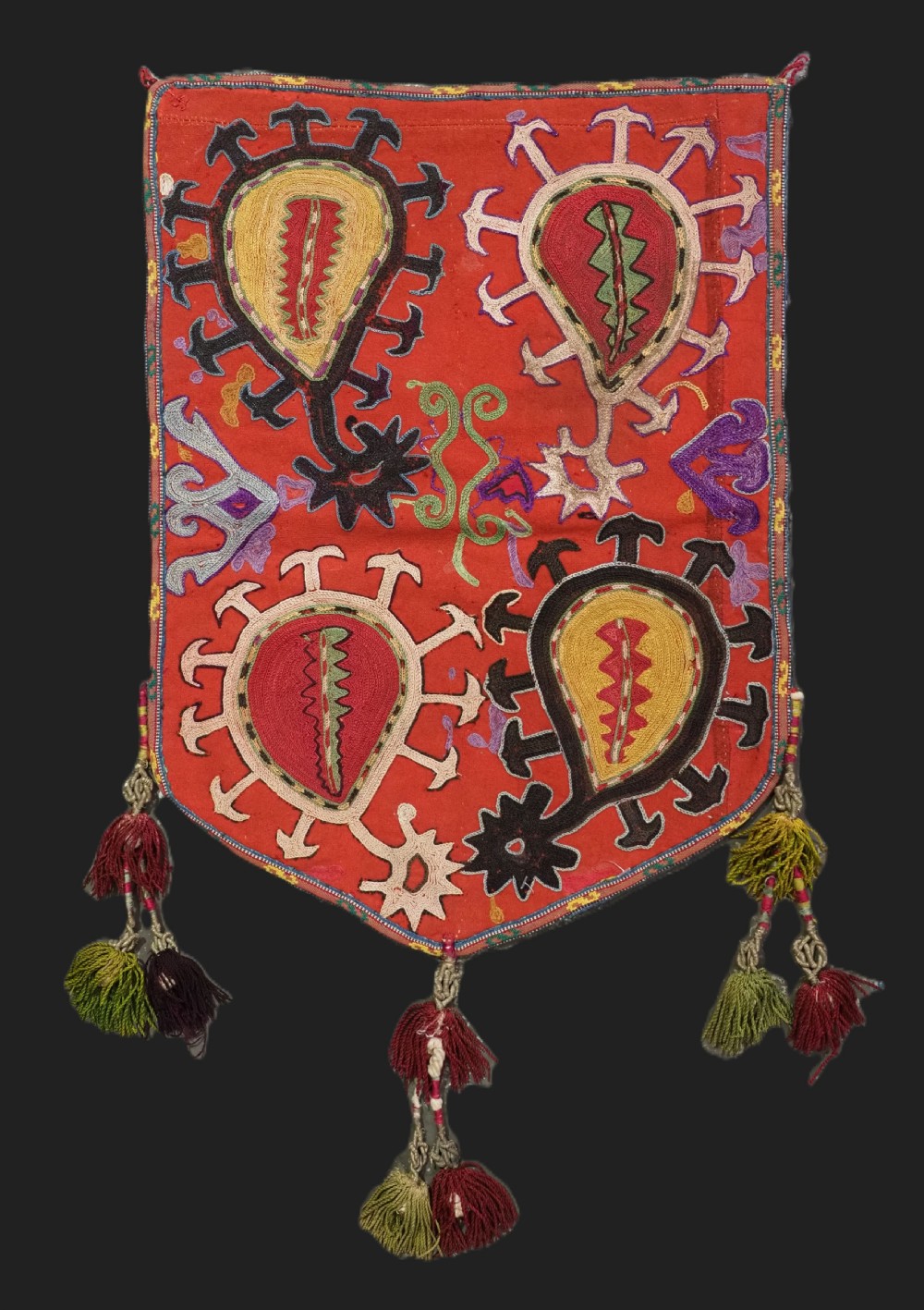 antique uzbek 'uut kap ilgich' silk on mogul red wool ground circa 1900