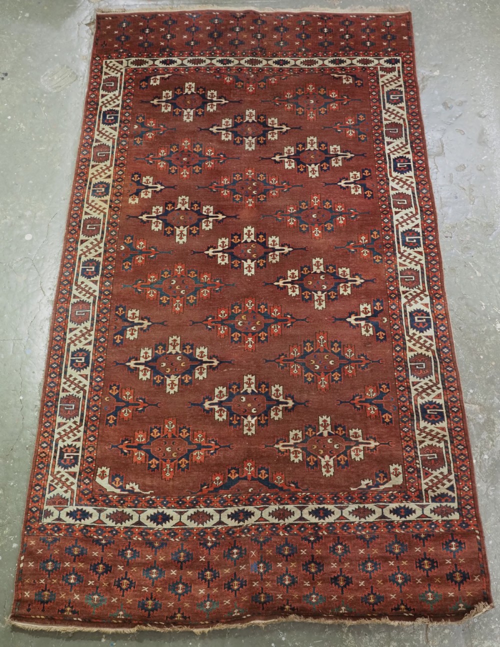 antique karadasahli yomut small main carpet with ccentred kepse guls early 19th century